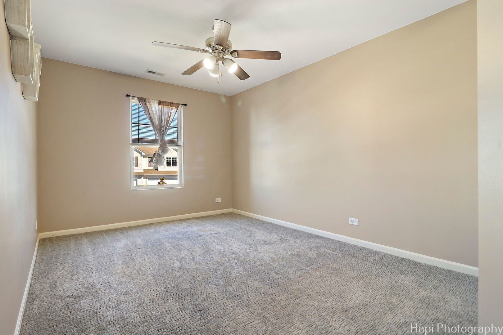 672 Anchorage Court Pingree Grove, IL 60140 - Photo 17 of 31 an empty room with windows and fan