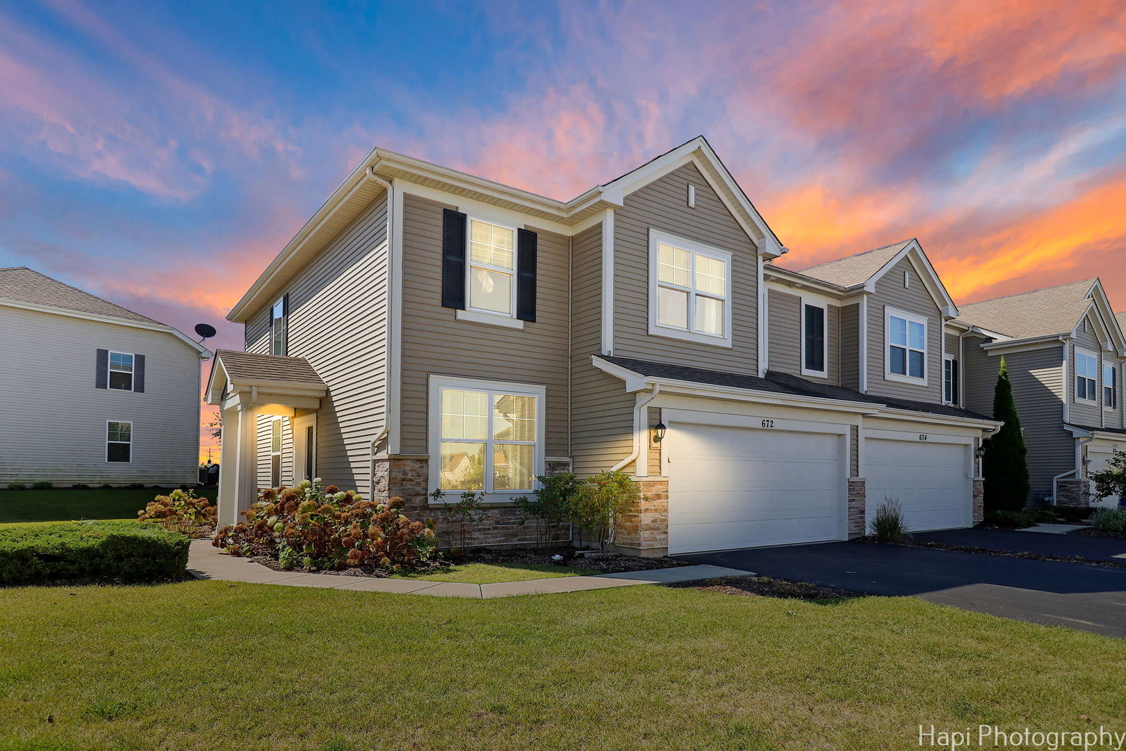 672 Anchorage Court Pingree Grove, IL 60140 - Photo 2 of 31 a front view of a house with a yard and garage