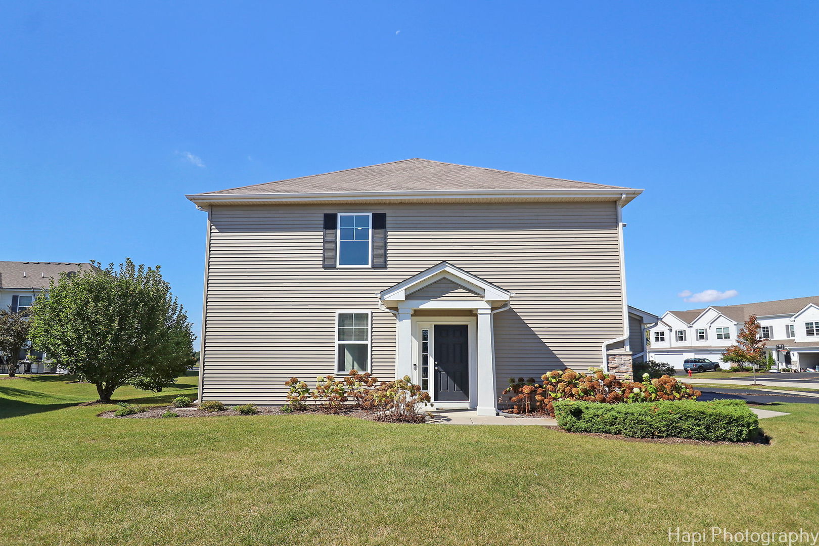 672 Anchorage Court Pingree Grove, IL 60140 - Photo 23 of 31 a front view of a house with a garden