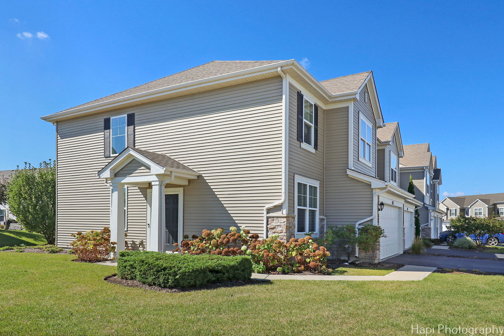 672 Anchorage Court Pingree Grove, IL 60140 - Photo 24 of 31 a front view of a house with a garden