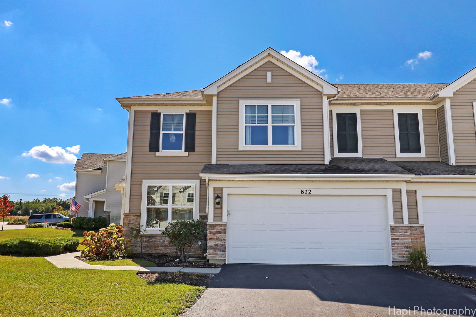 672 Anchorage Court Pingree Grove, IL 60140 - Photo 25 of 31 a front view of a house with garden