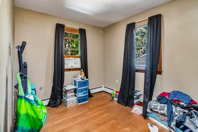 a bed room with a bed and a window