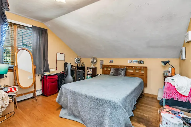 a bed room with a bed and a chandelier