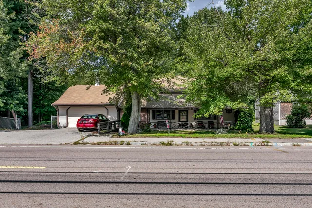 a view of a parked cars in front of a house
