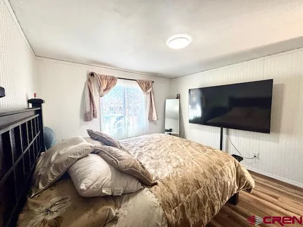 a bedroom with a bed and a walk in closet