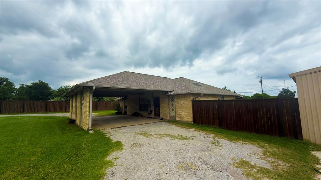 1356 Kerry Lane Azle, TX 76020 - Photo 4 of 27 Single-story residence featuring a brick exterior and a covered carport with brick columns