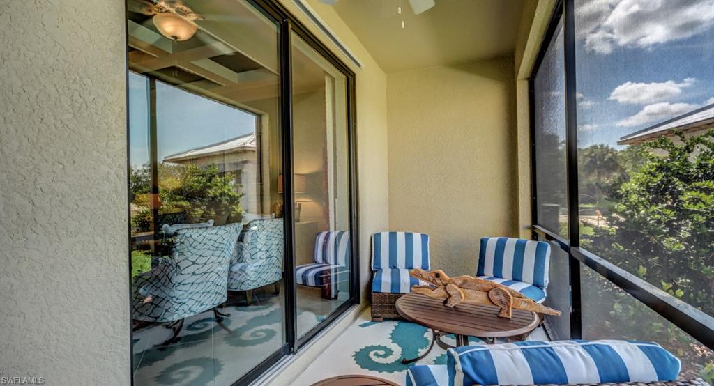 2767 Citrus Street Naples, FL 34120 - Photo 20 of 27 a balcony with furniture and wooden floor