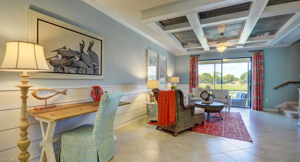 2767 Citrus Street Naples, FL 34120 - Photo 7 of 27 a living room with furniture and a large window