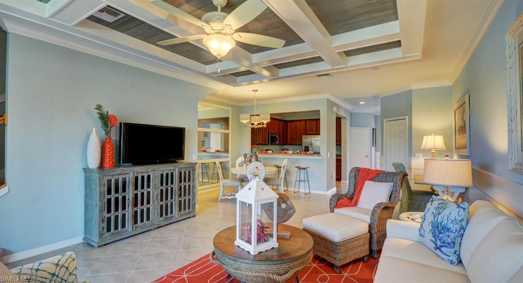 2767 Citrus Street Naples, FL 34120 - Photo 10 of 27 a living room with furniture and a flat screen tv