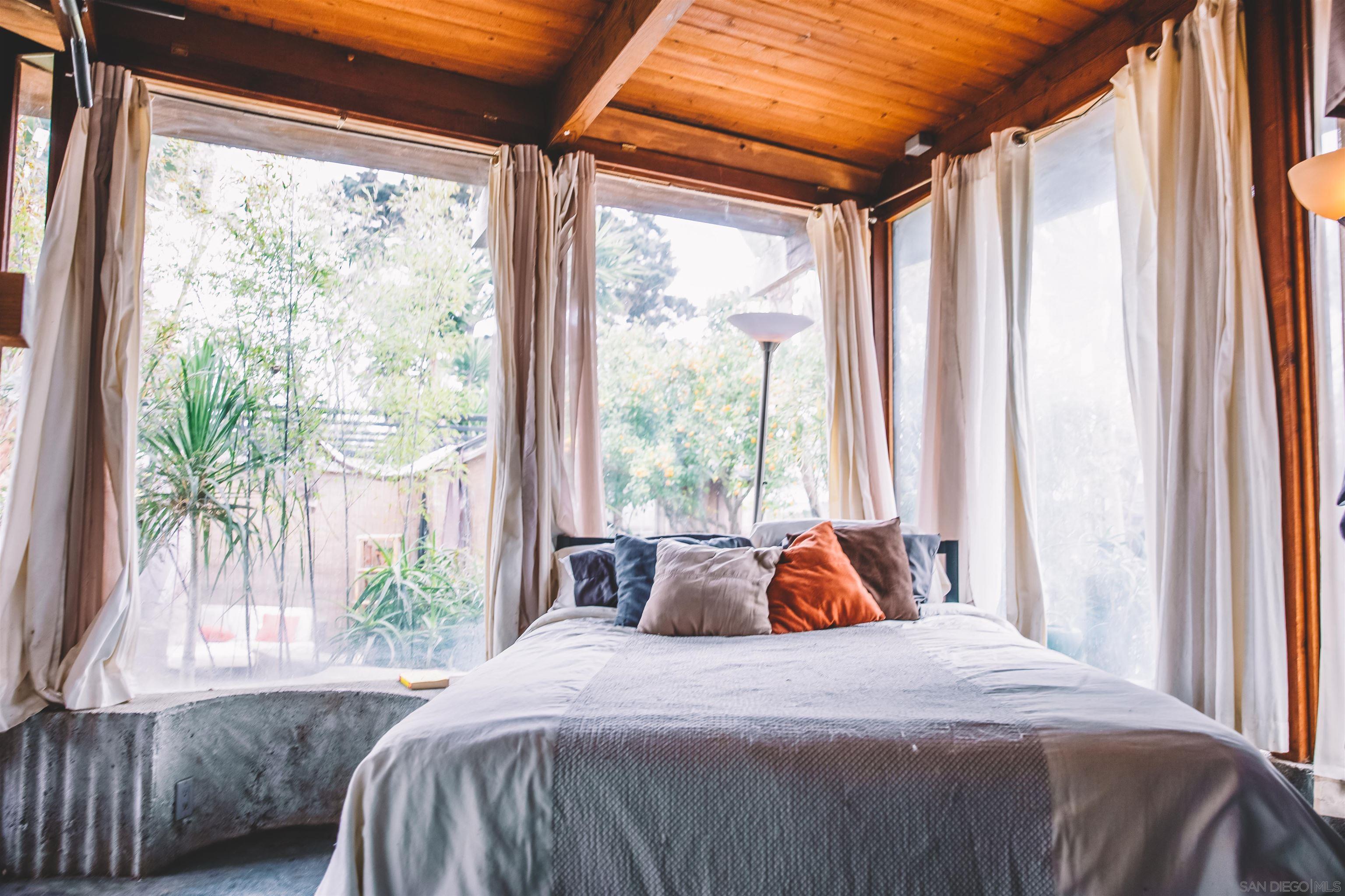 1347 Summit Avenue, Unit MIDDLE Encinitas, CA 92007 - Photo 12 of 19 a bedroom with a bed and a window