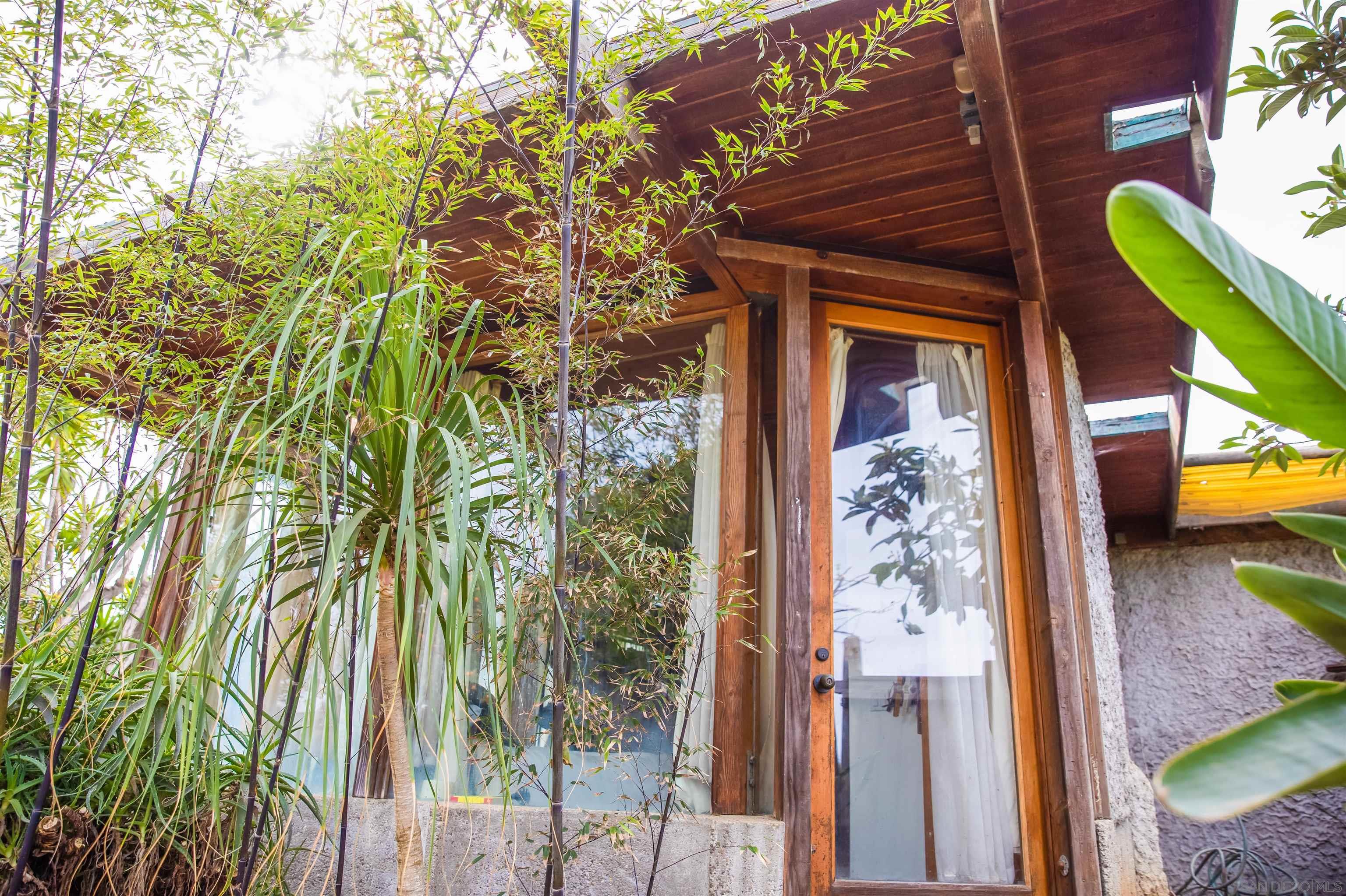 1347 Summit Avenue, Unit MIDDLE Encinitas, CA 92007 - Photo 14 of 19 a front view of a house with a yard