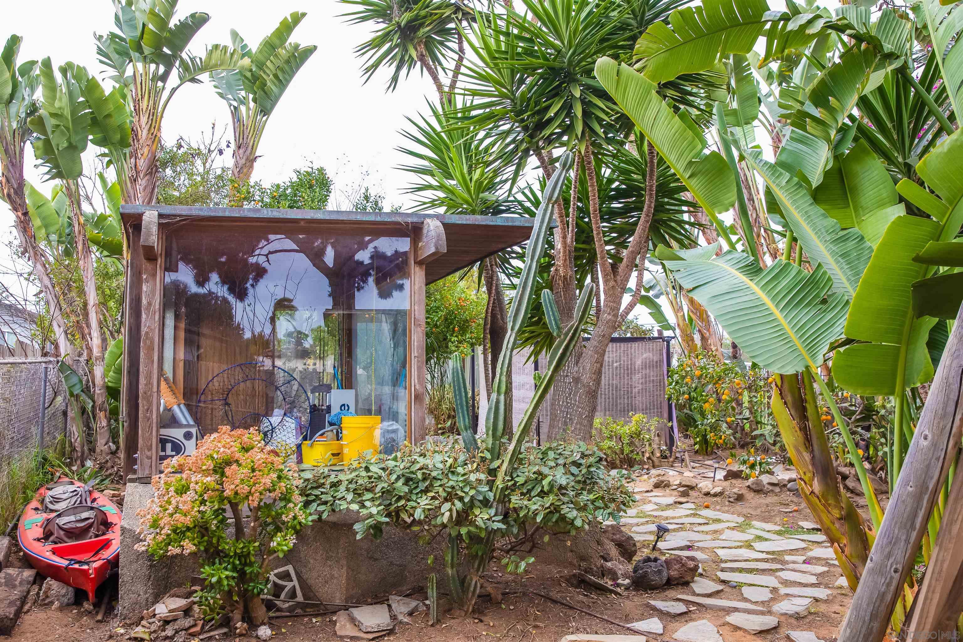 1347 Summit Avenue, Unit MIDDLE Encinitas, CA 92007 - Photo 17 of 19 a view of a potted flower in a garden
