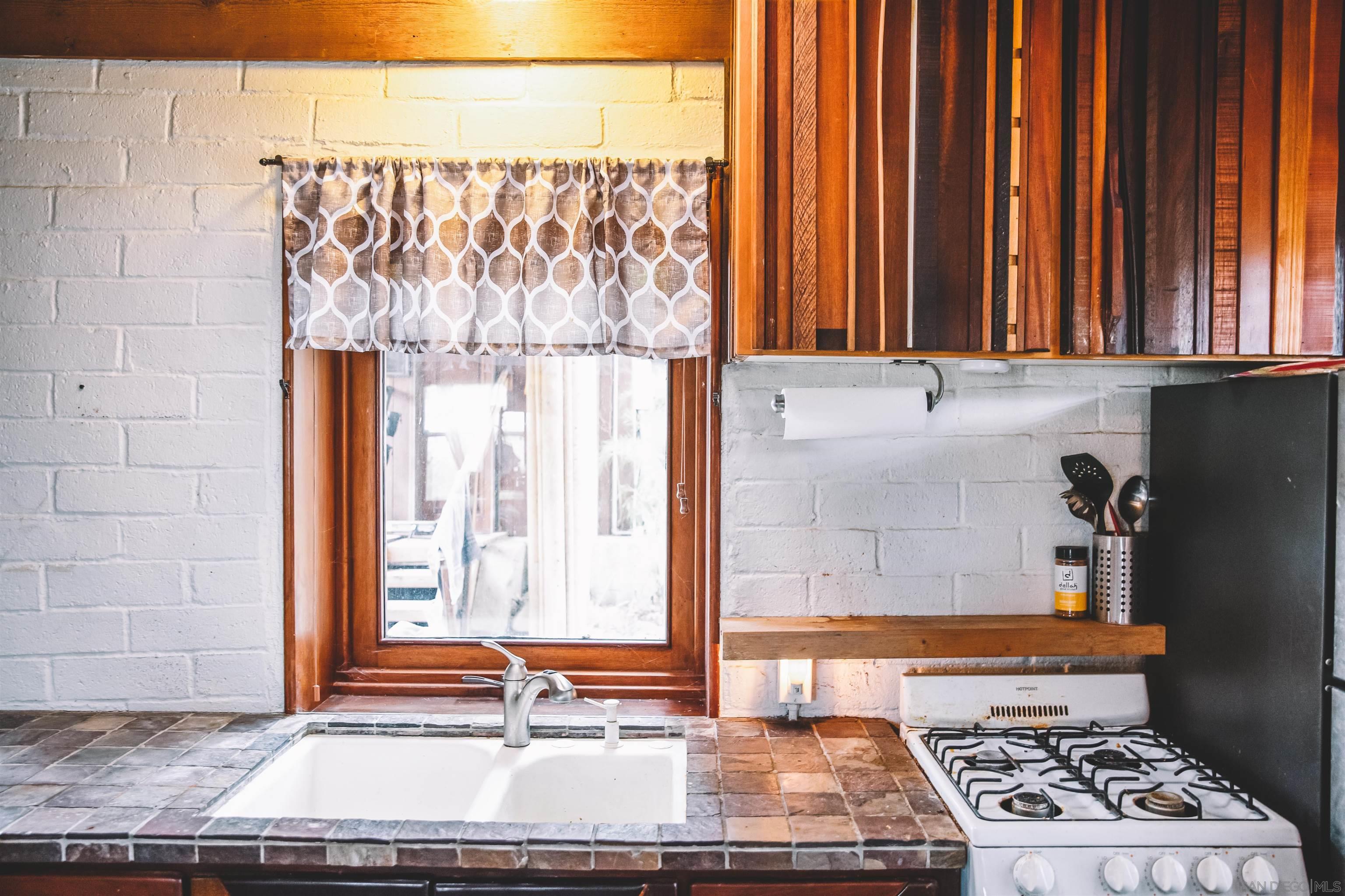 1347 Summit Avenue, Unit MIDDLE Encinitas, CA 92007 - Photo 3 of 19 a view of a sink and a window