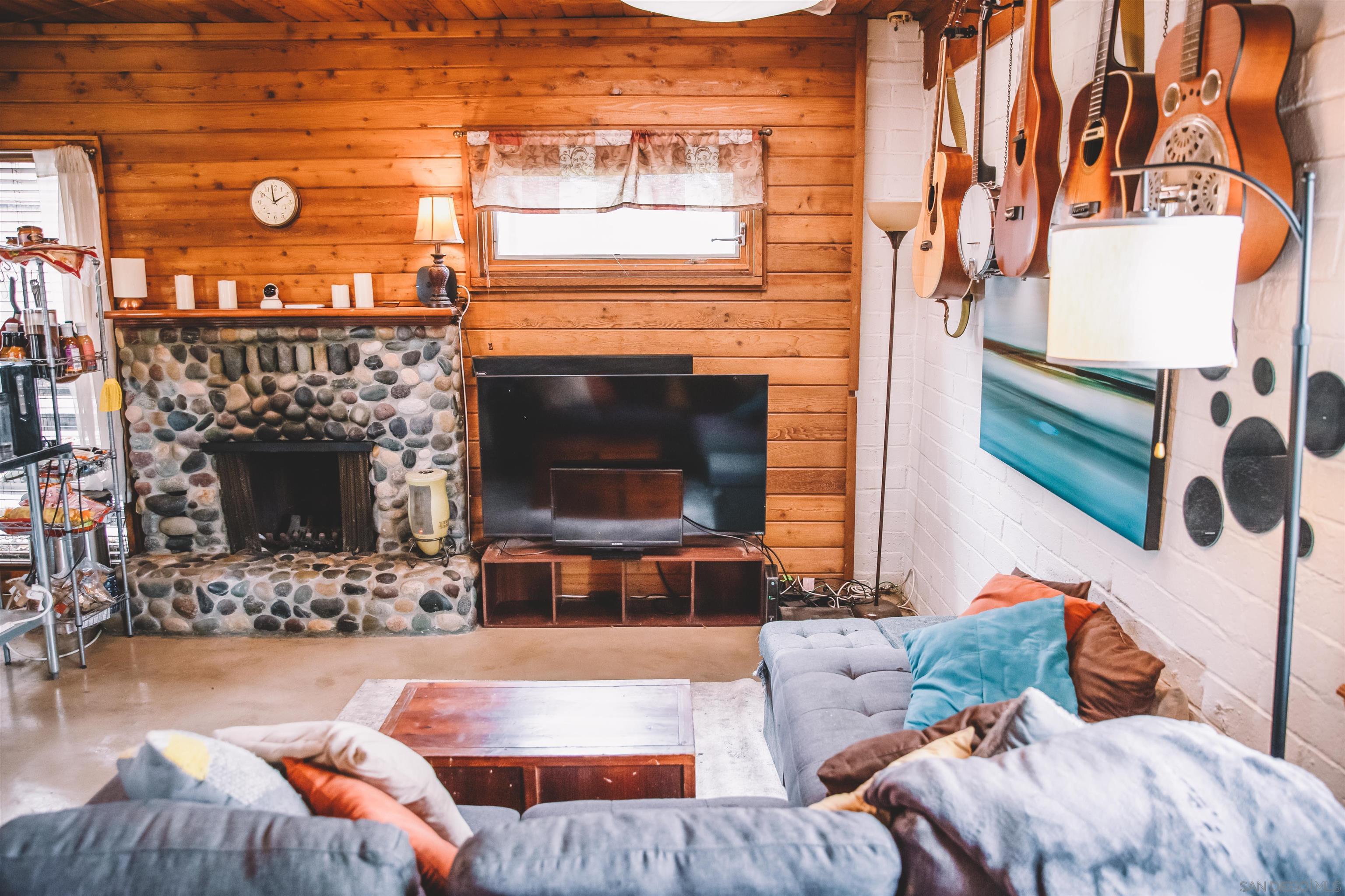 1347 Summit Avenue, Unit MIDDLE Encinitas, CA 92007 - Photo 6 of 19 a living room with furniture and a fireplace