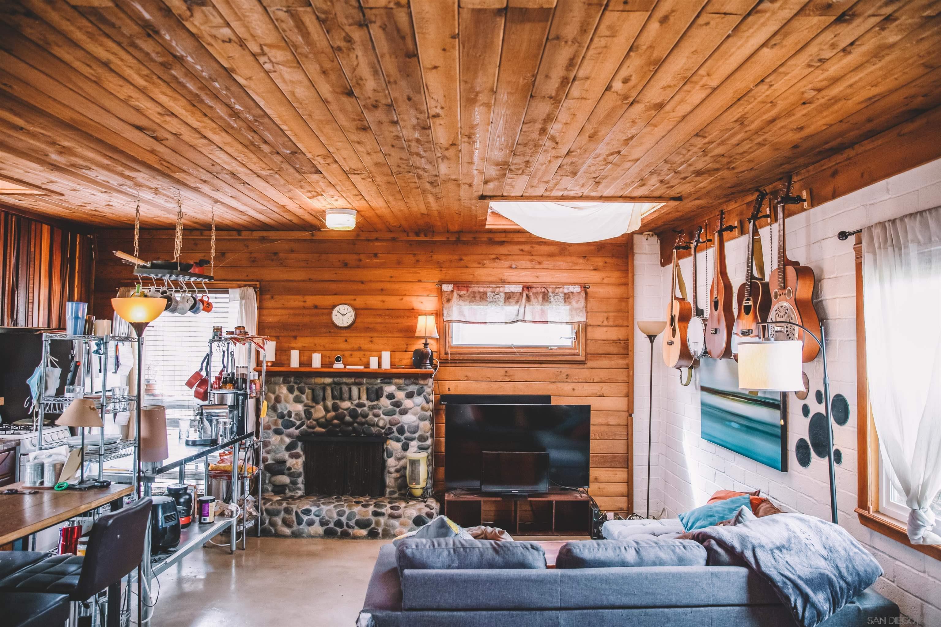 1347 Summit Avenue, Unit MIDDLE Encinitas, CA 92007 - Photo 8 of 19 a living room with furniture and a fireplace