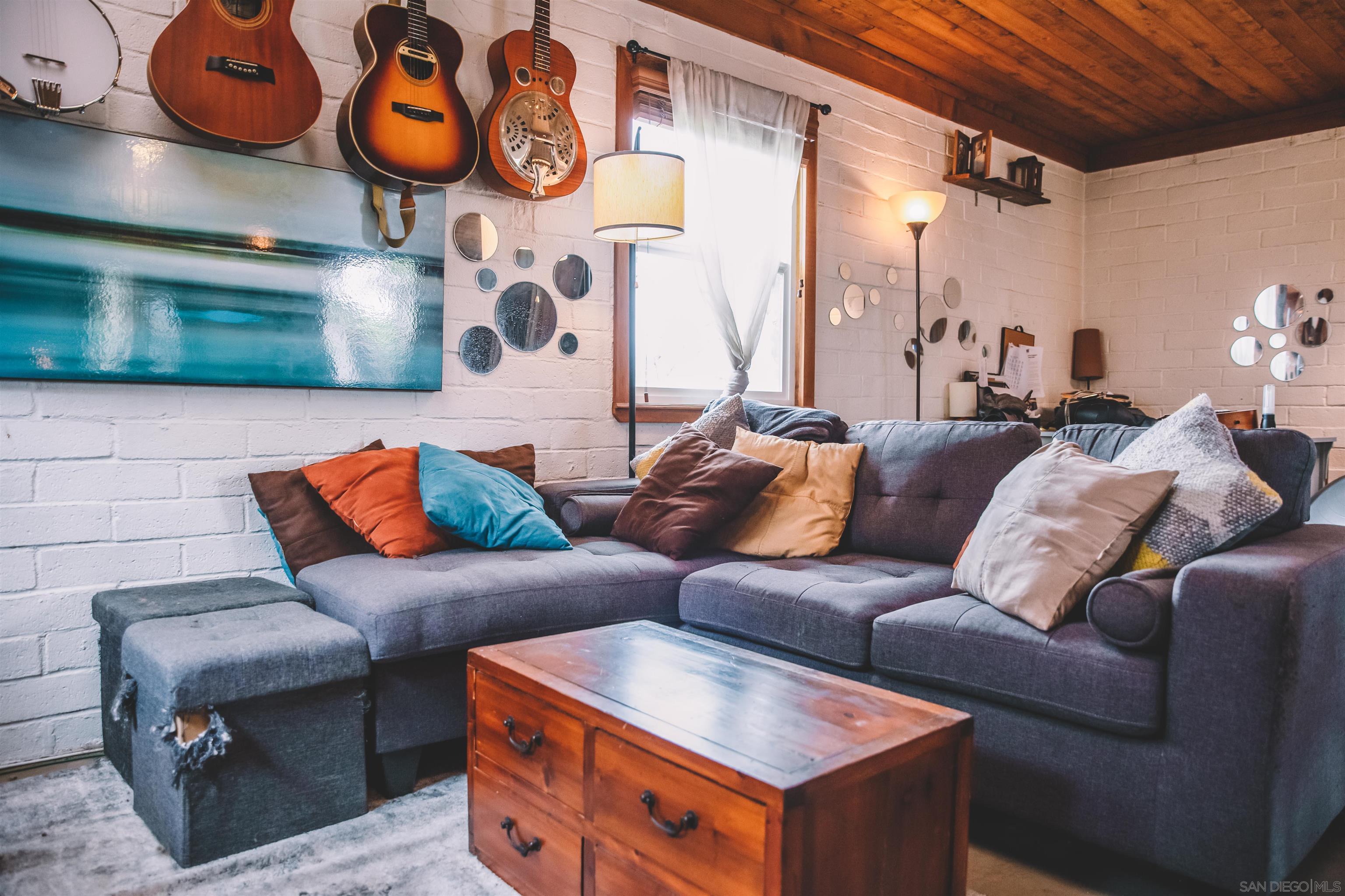 1347 Summit Avenue, Unit MIDDLE Encinitas, CA 92007 - Photo 10 of 19 a living room with furniture and a kitchen view