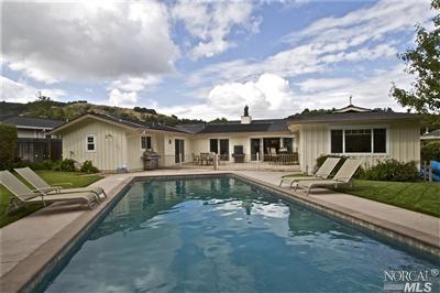 35 Locksly Lane San Rafael, CA 94901 - Photo 1 of 1 a view of a white house next to a yard with a large tree