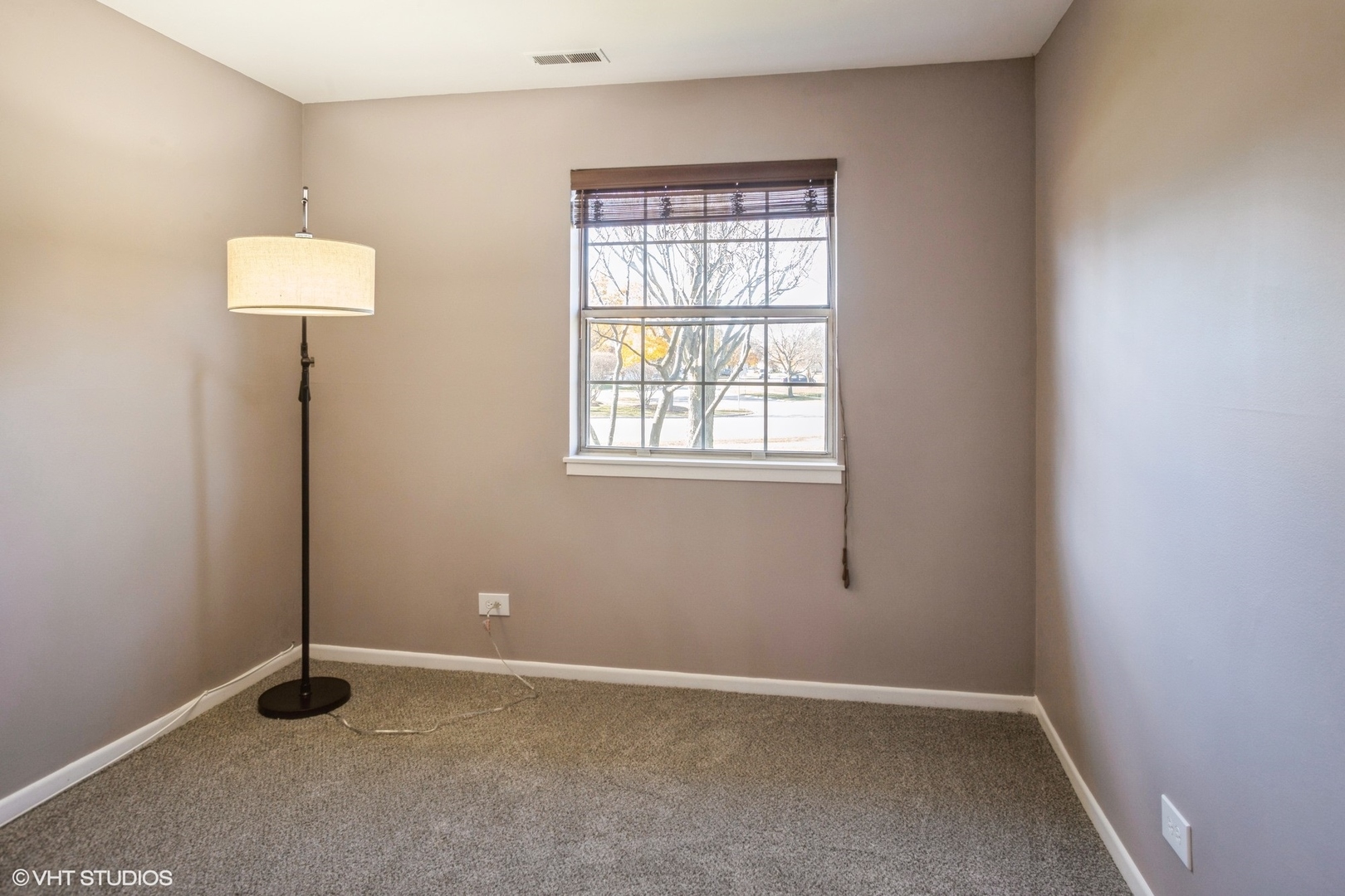 117 Gant Circle, Unit D Streamwood, IL 60107 - Photo 9 of 16 an empty room with windows