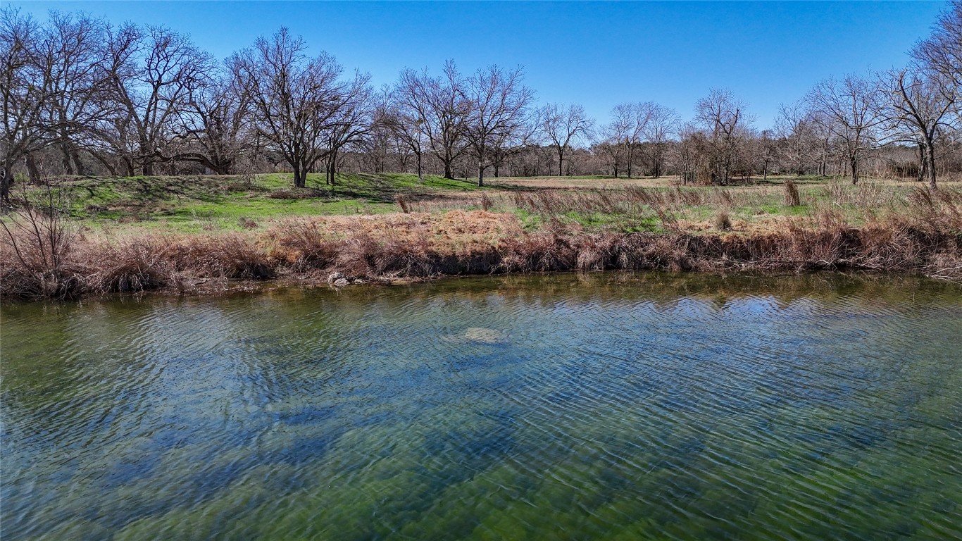 Tbd Lost Acres Loop Blanco, TX 78606 - Photo 2 of 39 a view of a lake with houses