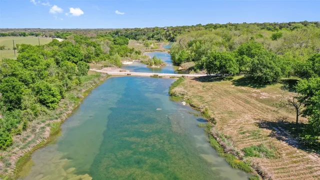 a view of a lake with a yard