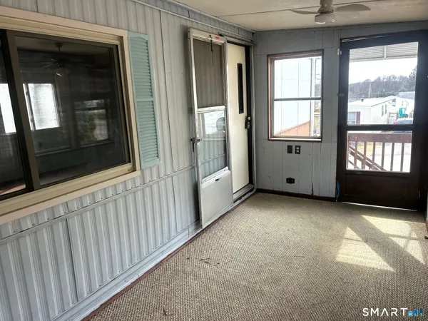 a view of an empty room with a window