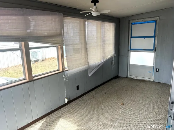 a view of an empty room with a window