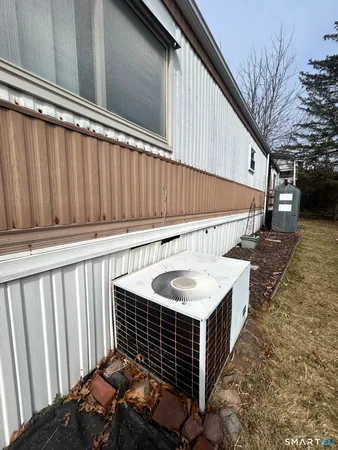 a barbeque oven on a table in front of a building