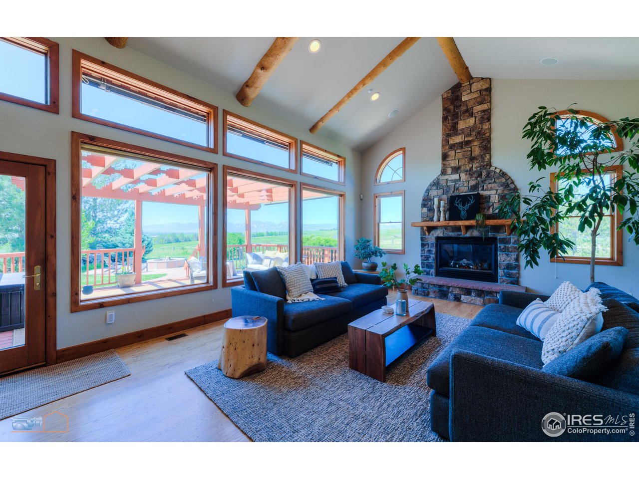 9428 Gunbarrel Ridge Road Boulder, CO 80301 - Photo 13 of 40 Breath taking views of the Flatirons from the expansive great room.