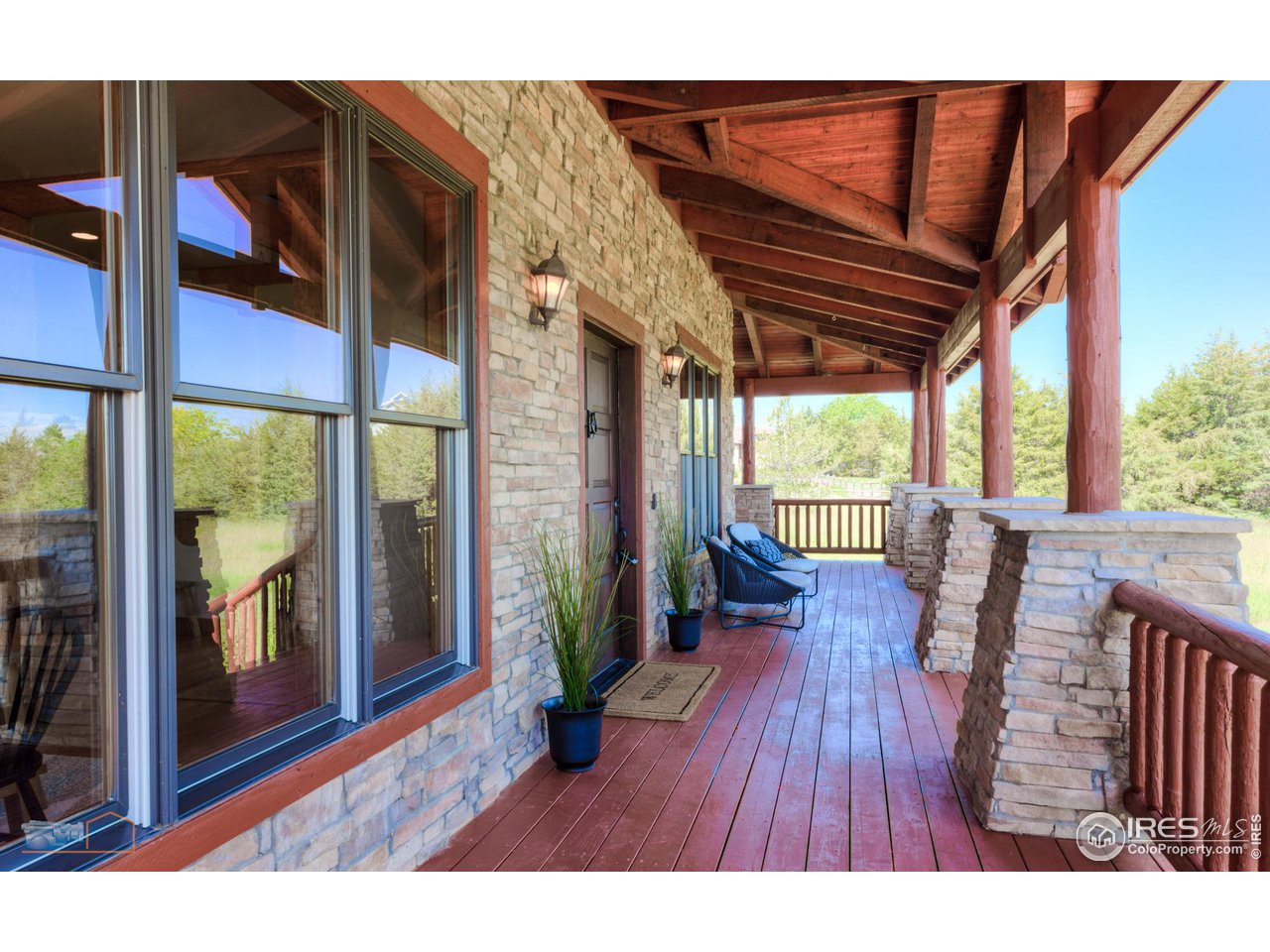 9428 Gunbarrel Ridge Road Boulder, CO 80301 - Photo 10 of 40 Listen to the birds from the wrap around porch