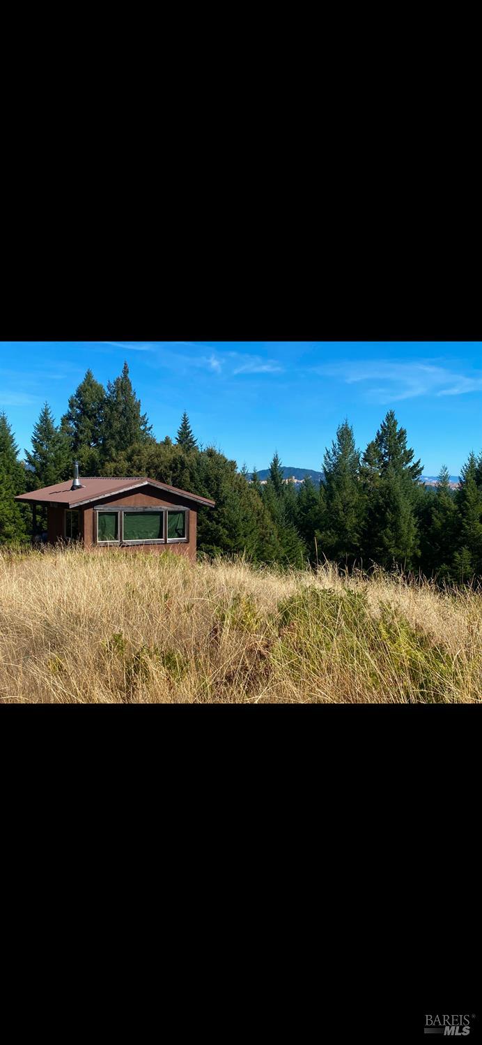 1701 Etter Ranch Road Garberville, CA 95542 - Photo 10 of 11 a view of a lake with outdoor space