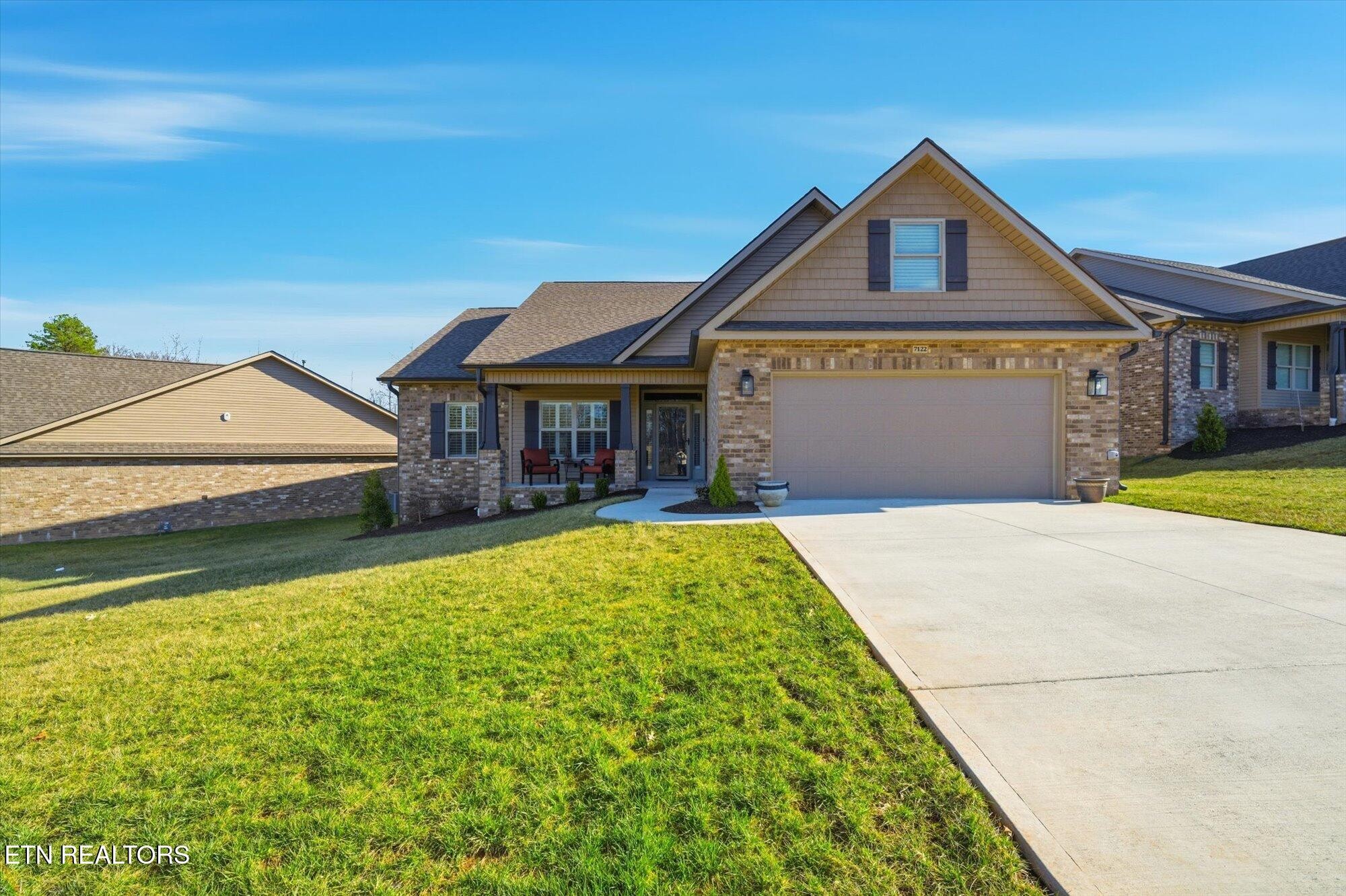 7122 Volunteer Rdg Lane Knoxville, TN 37918 - Photo 2 of 34 a front view of a house with a yard