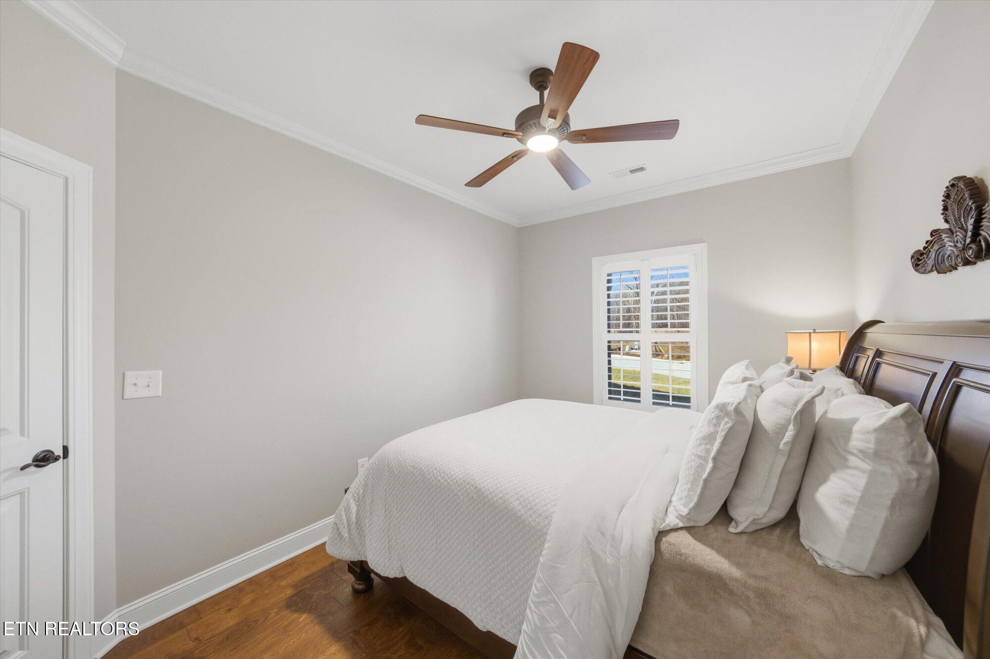 7122 Volunteer Rdg Lane Knoxville, TN 37918 - Photo 27 of 34 a bedroom with a bed and a window