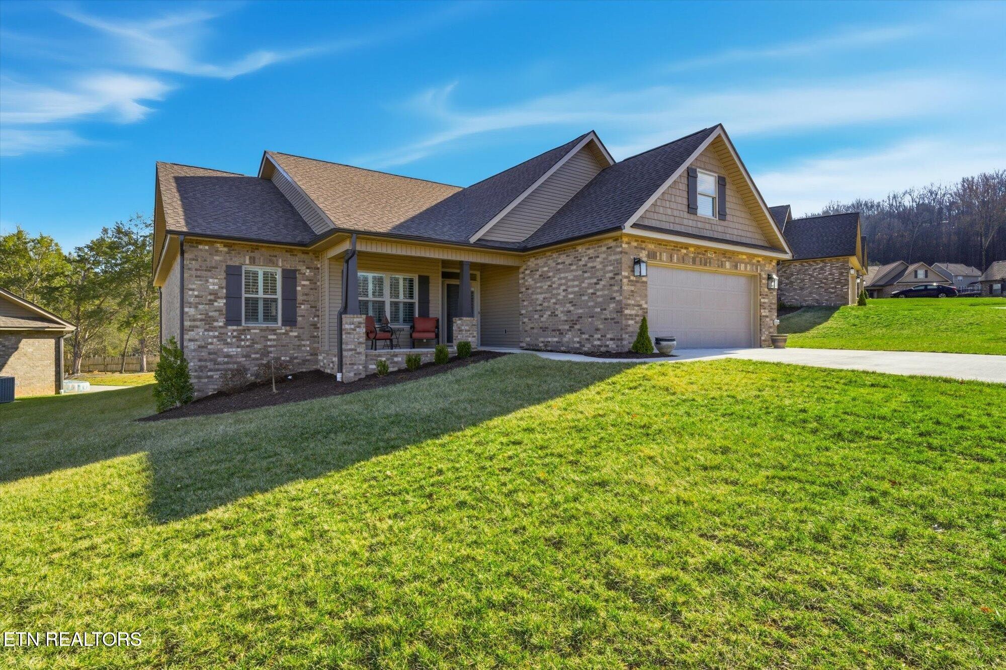 7122 Volunteer Rdg Lane Knoxville, TN 37918 - Photo 3 of 34 a front view of a house with garden