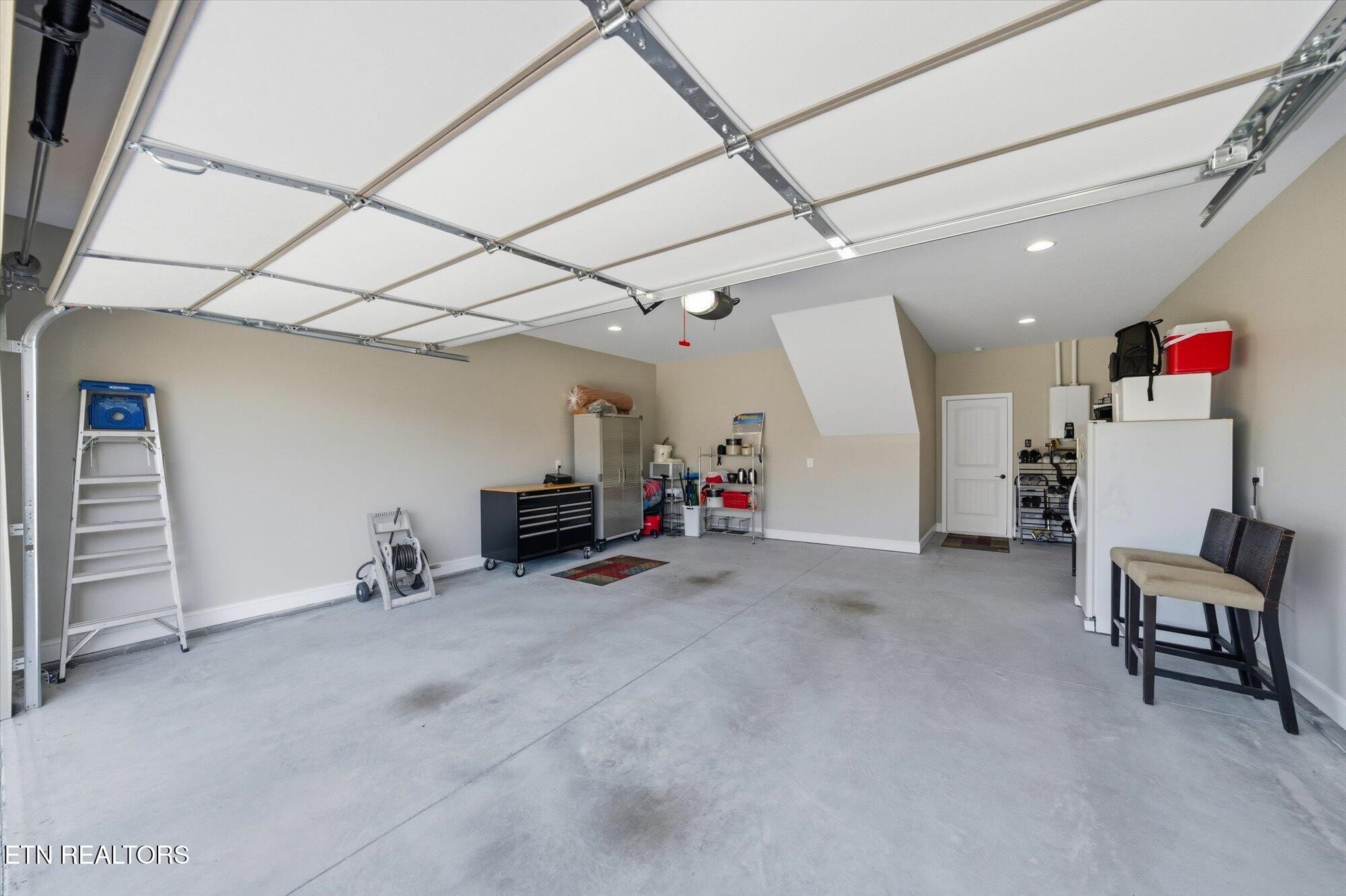 7122 Volunteer Rdg Lane Knoxville, TN 37918 - Photo 32 of 34 a view of a livingroom with furniture and a ceiling fan