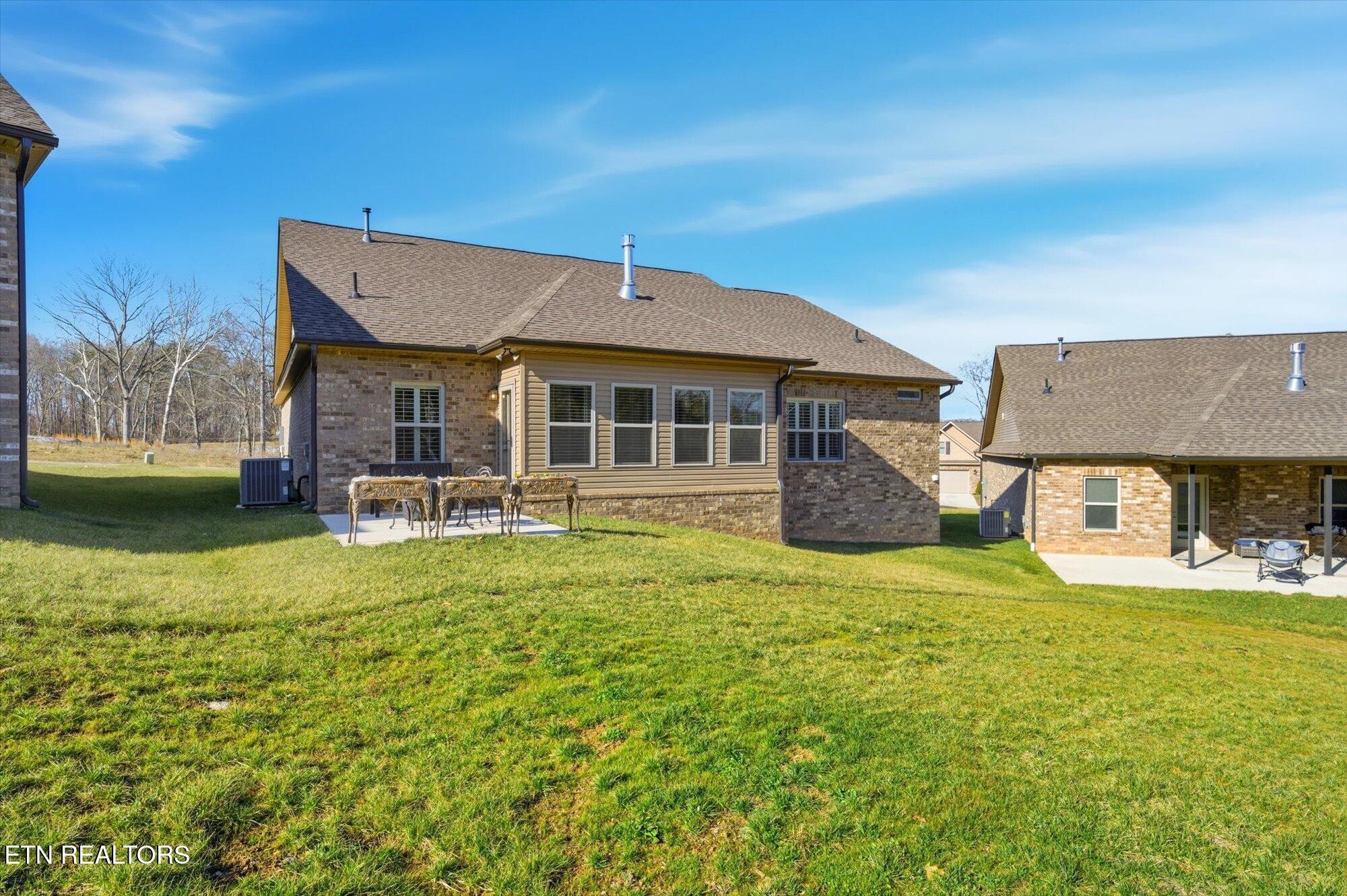 7122 Volunteer Rdg Lane Knoxville, TN 37918 - Photo 34 of 34 a front view of a house with a garden and trees