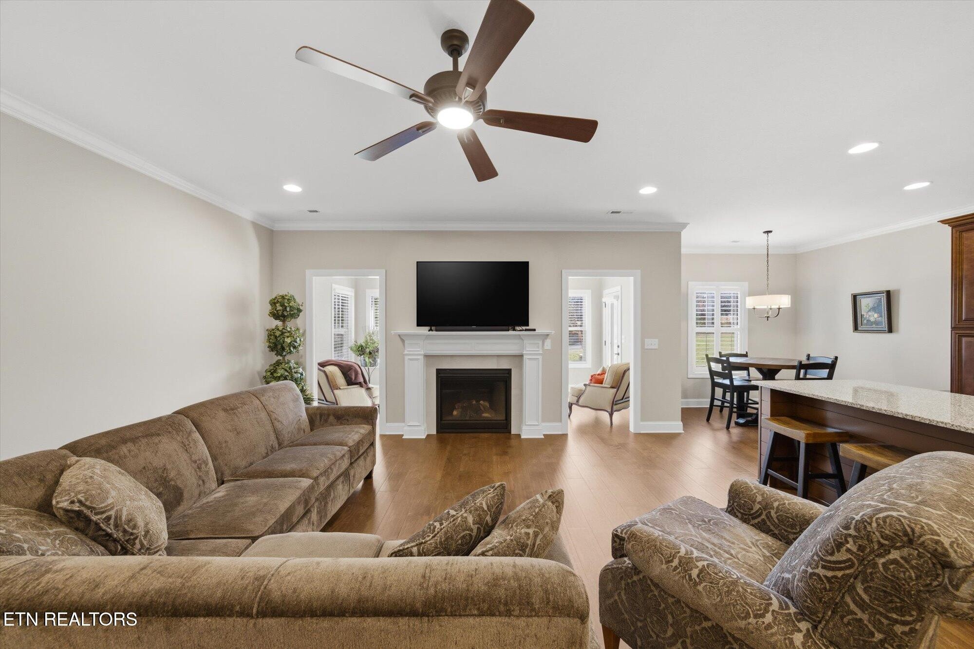 7122 Volunteer Rdg Lane Knoxville, TN 37918 - Photo 8 of 34 a living room with furniture a fireplace and a flat screen tv