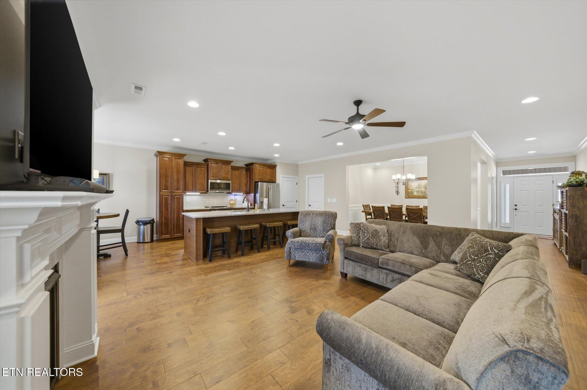 7122 Volunteer Rdg Lane Knoxville, TN 37918 - Photo 10 of 34 a living room with furniture and a flat screen tv