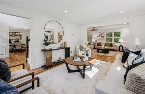 a kitchen with a refrigerator and a stove top oven