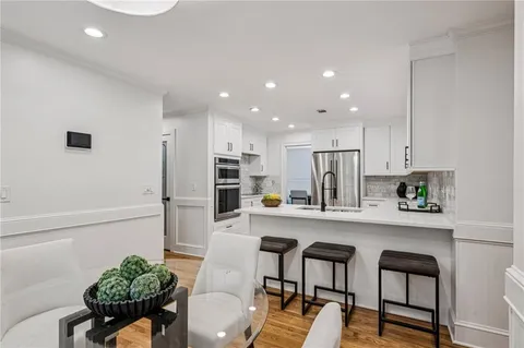 a bed room with a bed and a chandelier