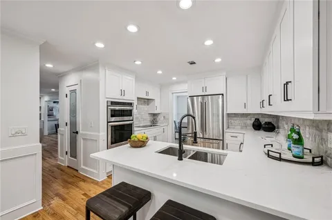 a bathroom with a bathtub and a window