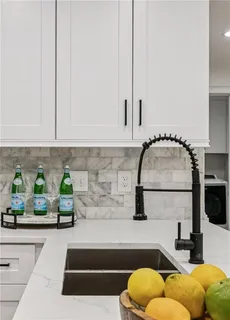 a en suite bathroom with a toilet sink and mirror