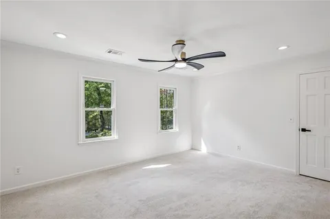 an aerial view of a house with a yard basket ball court and outdoor seating