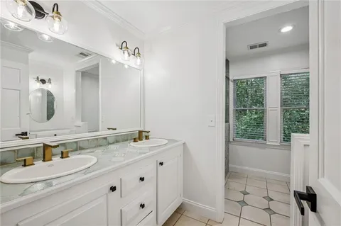 a view of house with outdoor space and sitting area