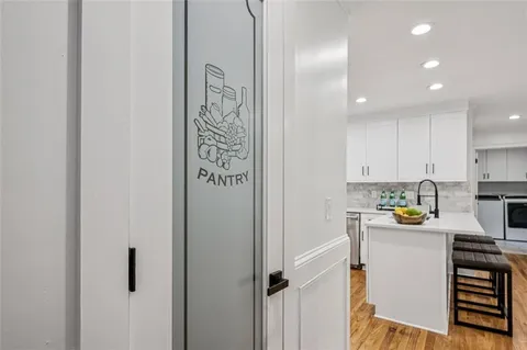 a bed room with a bed and a chandelier