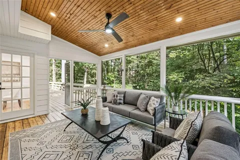 a view of entryway with wooden floor and a livingroom view