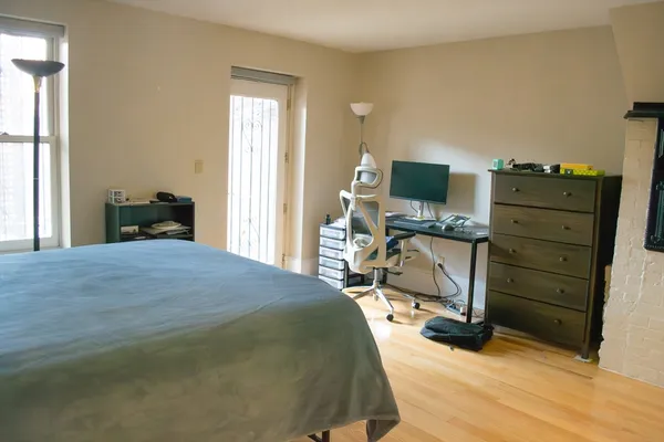 a bedroom with a bed and furniture