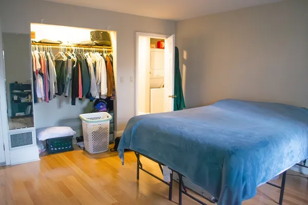 a bedroom with a bed and a view of bathroom