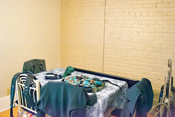 a view of balcony with furniture