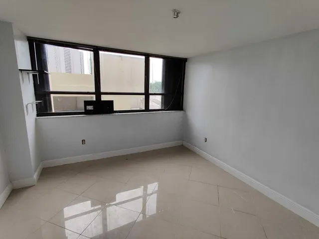 an empty room with a bathroom