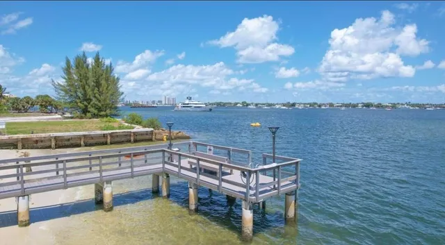 a view of a roof deck with chair and wooden floor